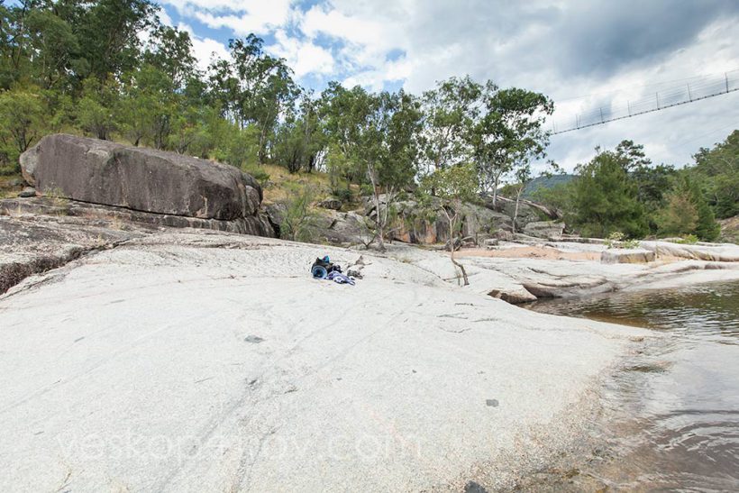 Vesko is swimming in the rock pool. You can see his hat, camera bag and towel.