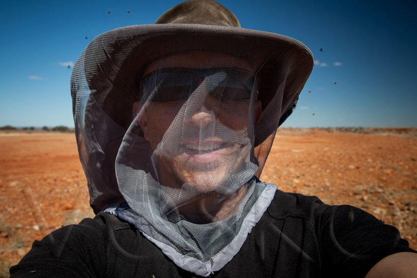 The outback flies are relentless. Only a fly net would save you (ridiculous hat and all).