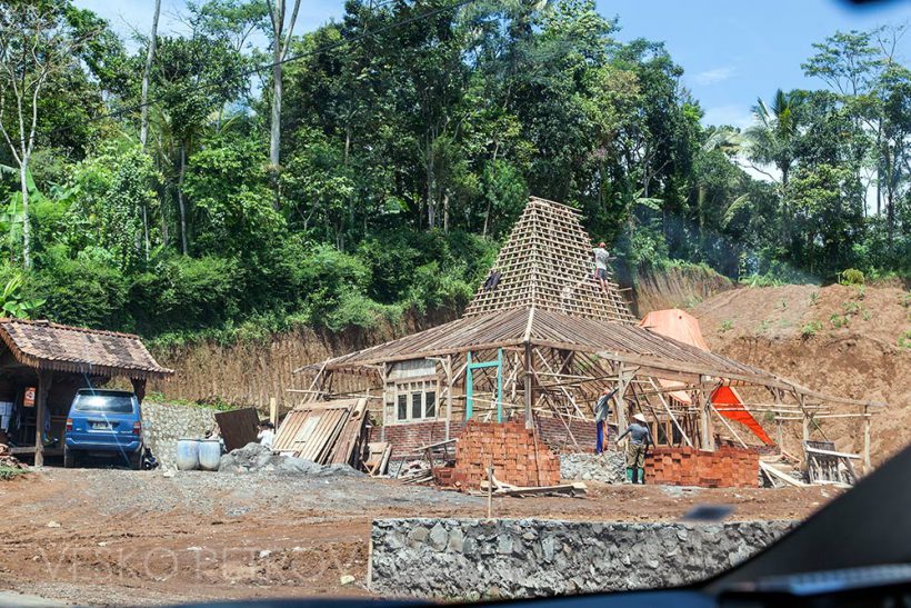 Someone is building a house in the traditional stile. I like the smart design of the roof suitable for the tropics.