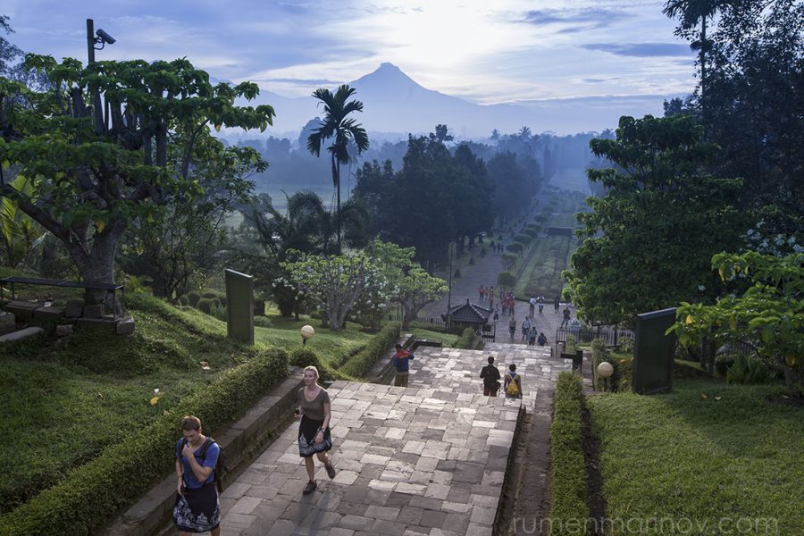 The sun is coming out behind Mt Merapi at Borobudur.