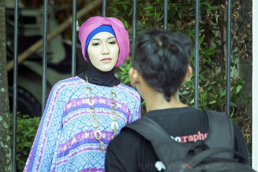 A photographer giving instructions to one of the models.