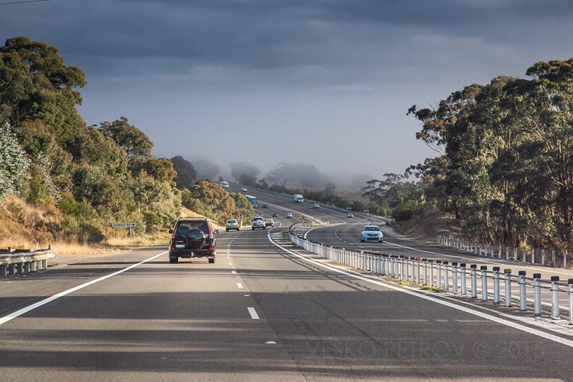 Out of Sydney the sun is just breaking the clouds.