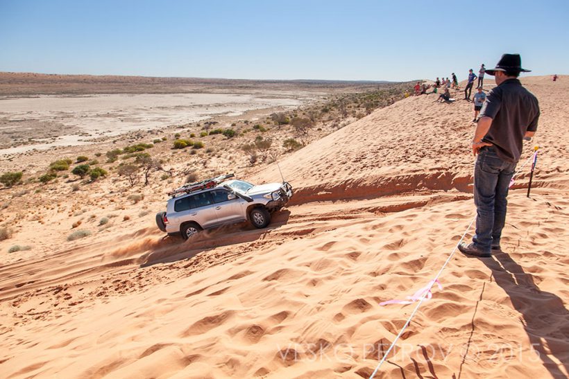 A heavy Toyota gets stuck in the sand tying to climb Big Red.