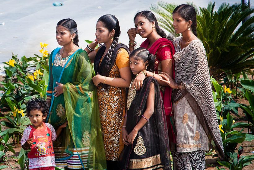 A few Tamil girls are getting ready for a photo in front of MGR Memorial.